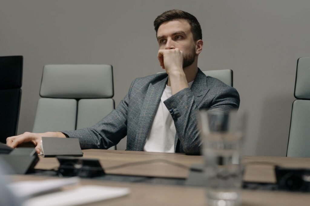 Person sitting at desk thinking about career decision