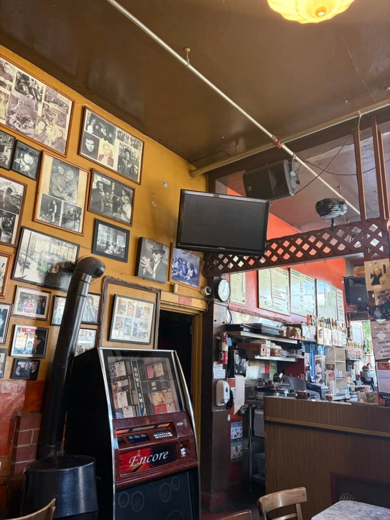 Caffè Trieste in North Beach: What to Expect at San Francisco's First Espresso Bar Vintage photos and murals on the walls of Caffè Trieste