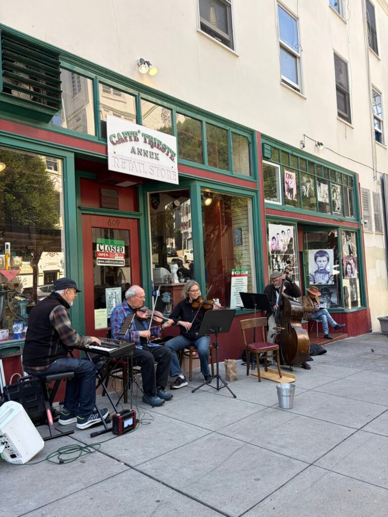 Caffè Trieste in North Beach: What to Expect at San Francisco's First Espresso Bar Elderly musicians performing live music outside Caffè Trieste, San Francisco