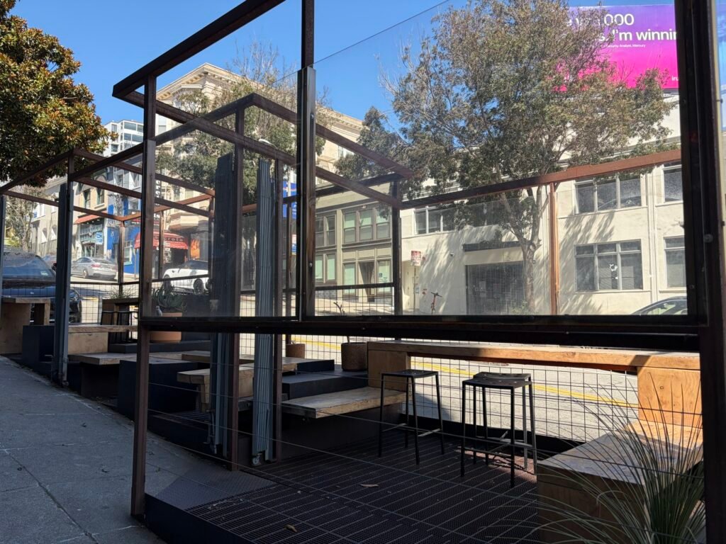 Outdoor sidewalk seating at Réveille Coffee Co. in North Beach