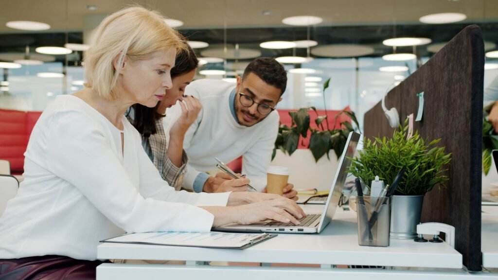 Job Security vs Career Growth: Which Should You Prioritize? office worker thinking at a desk with a laptop