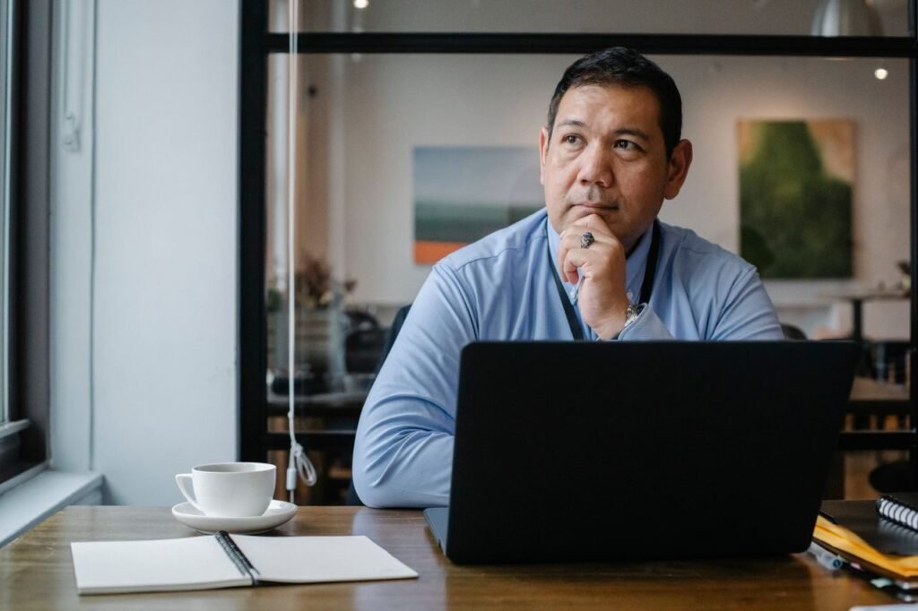 Passion vs. Paycheck: How to Choose the Career That's Right for You Person weighing job satisfaction against paycheck at desk