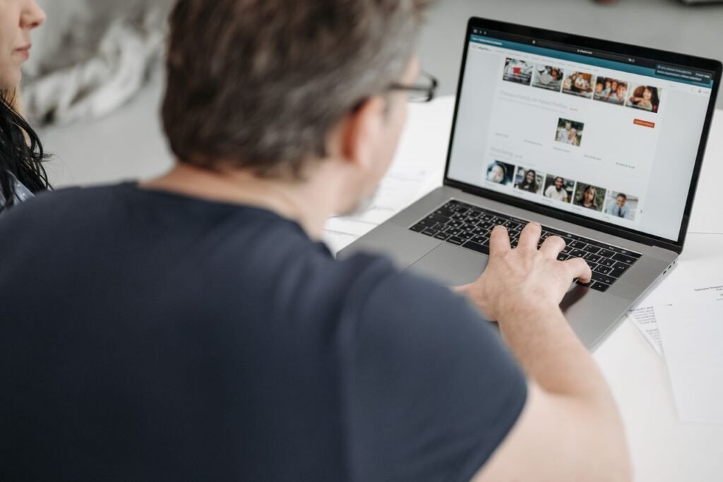 Professional updating LinkedIn profile for personal branding